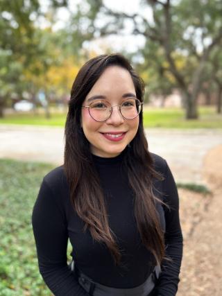 A woman wearing a black turtleneck.